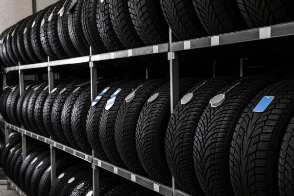 Car tires on rack in auto store